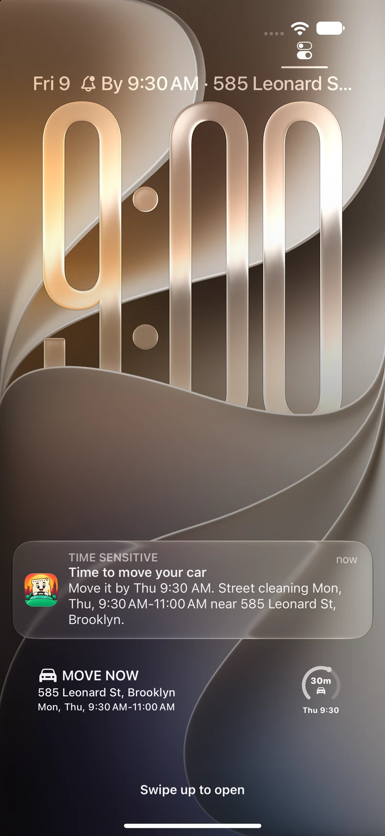 Native iPhone Lock Screen with a Park with Spark notification saying it is time to move the car.